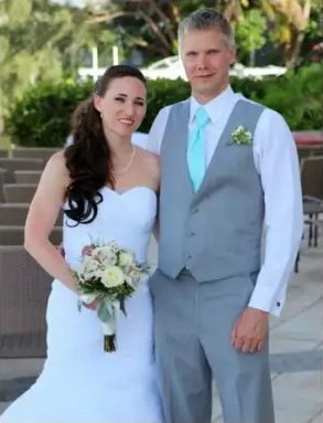 Ashley and her husband together on their wedding day